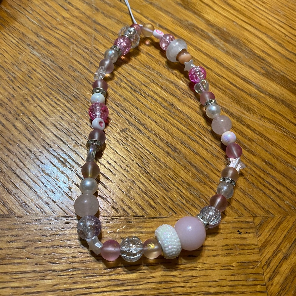 Pink and white handmade beaded phone strap